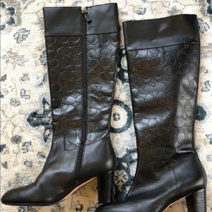 Coach signature logo embossed leather boots.